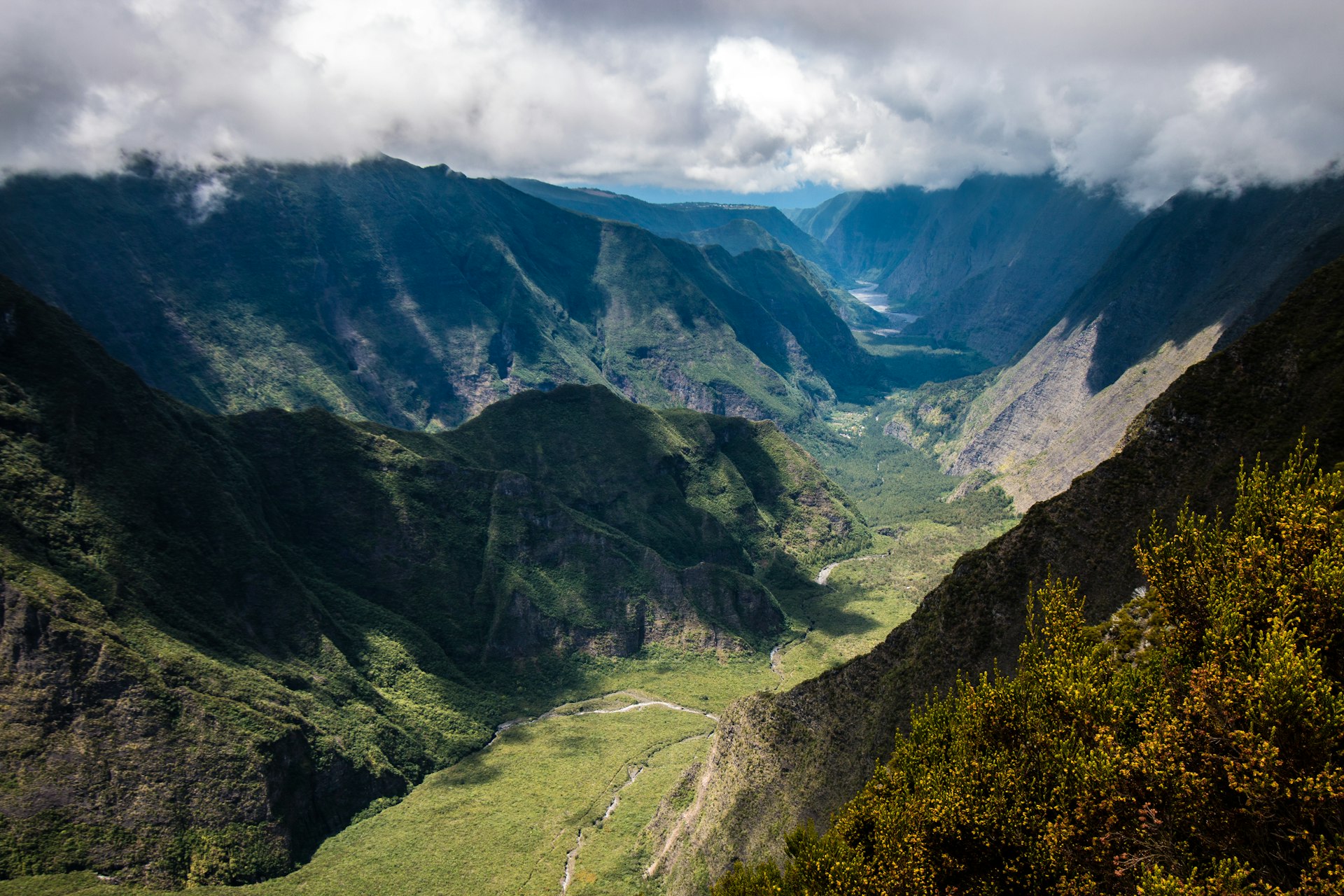 aerial photography of mountain range under cloudy sky during daytime